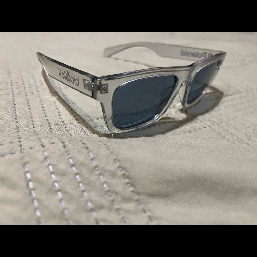 Polaroid blue sunglasses in clear grey frame
